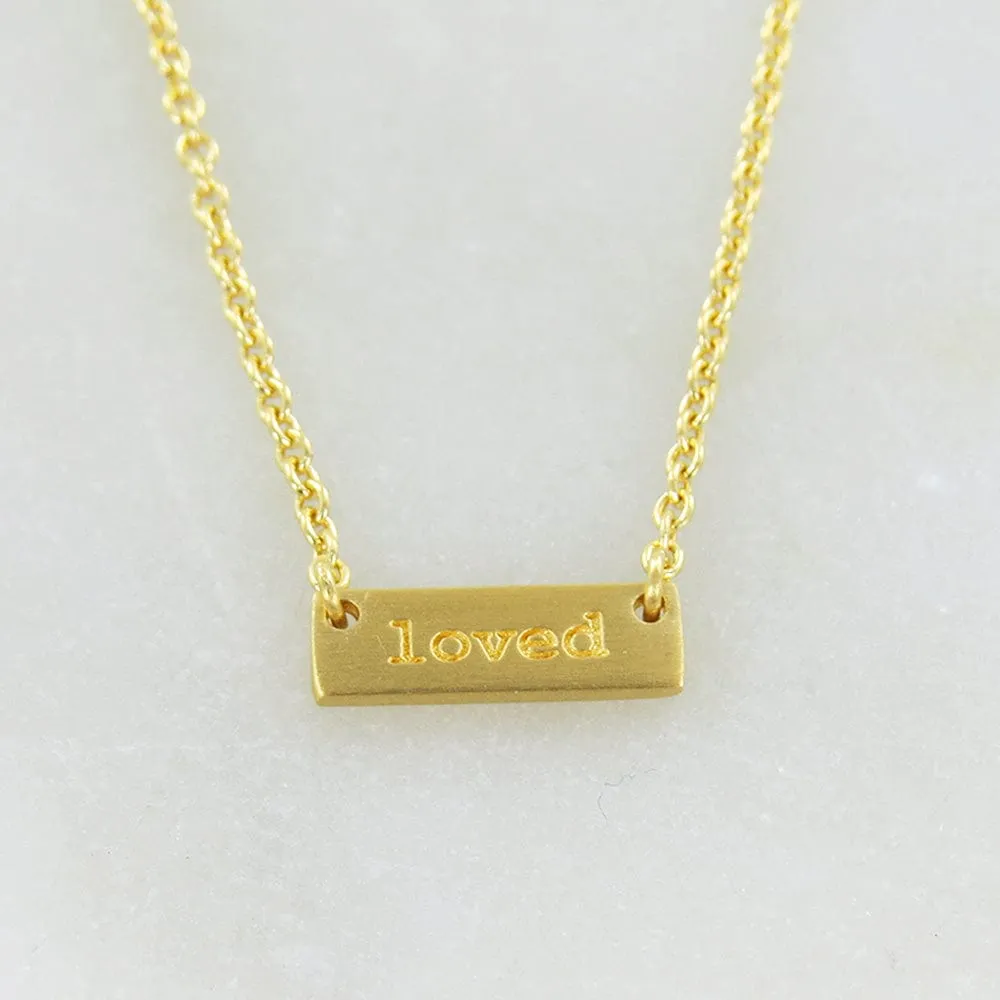 "LOVED" TINY PLATE BRUSHED GOLD NECKLACE